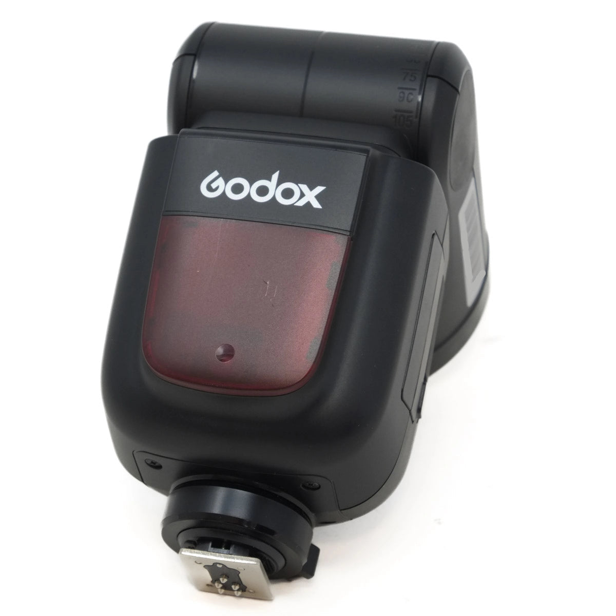 Black Godox camera flash unit on a white background