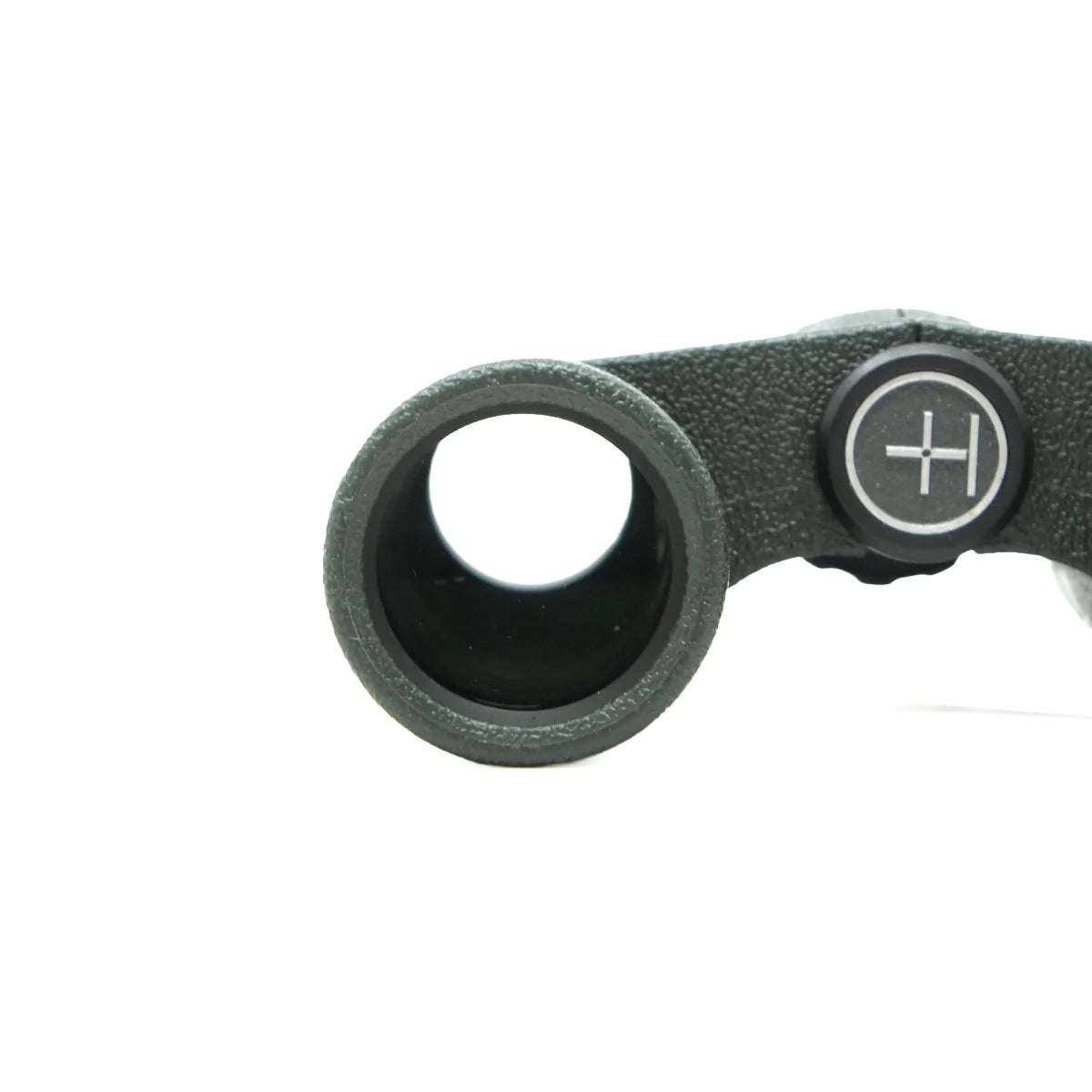 Close-up of a black textured eyepiece or optical component with a circular adjustment knob featuring a white cross-hatch symbol, on a plain white background.