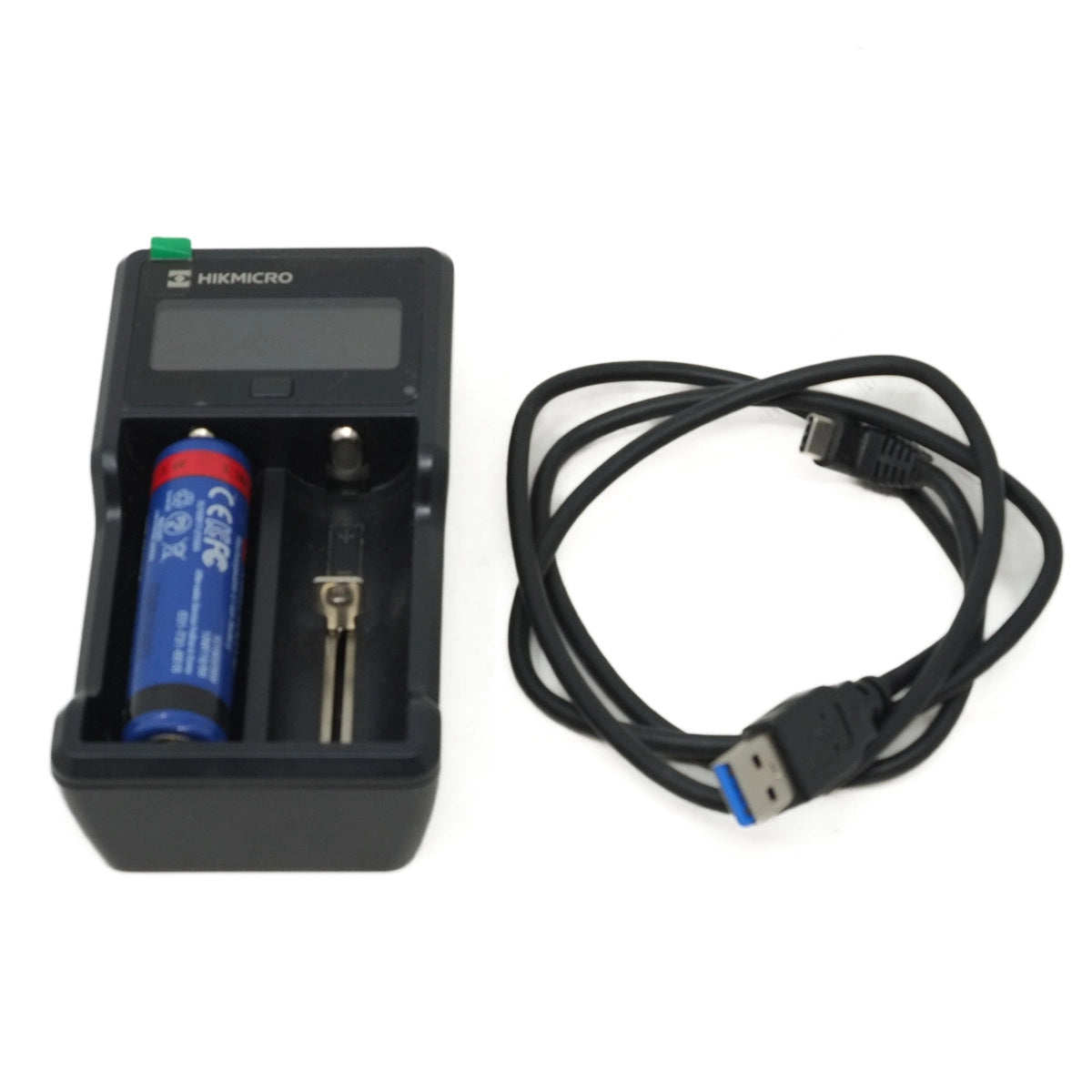 Battery charger with a battery and USB cable on a white background