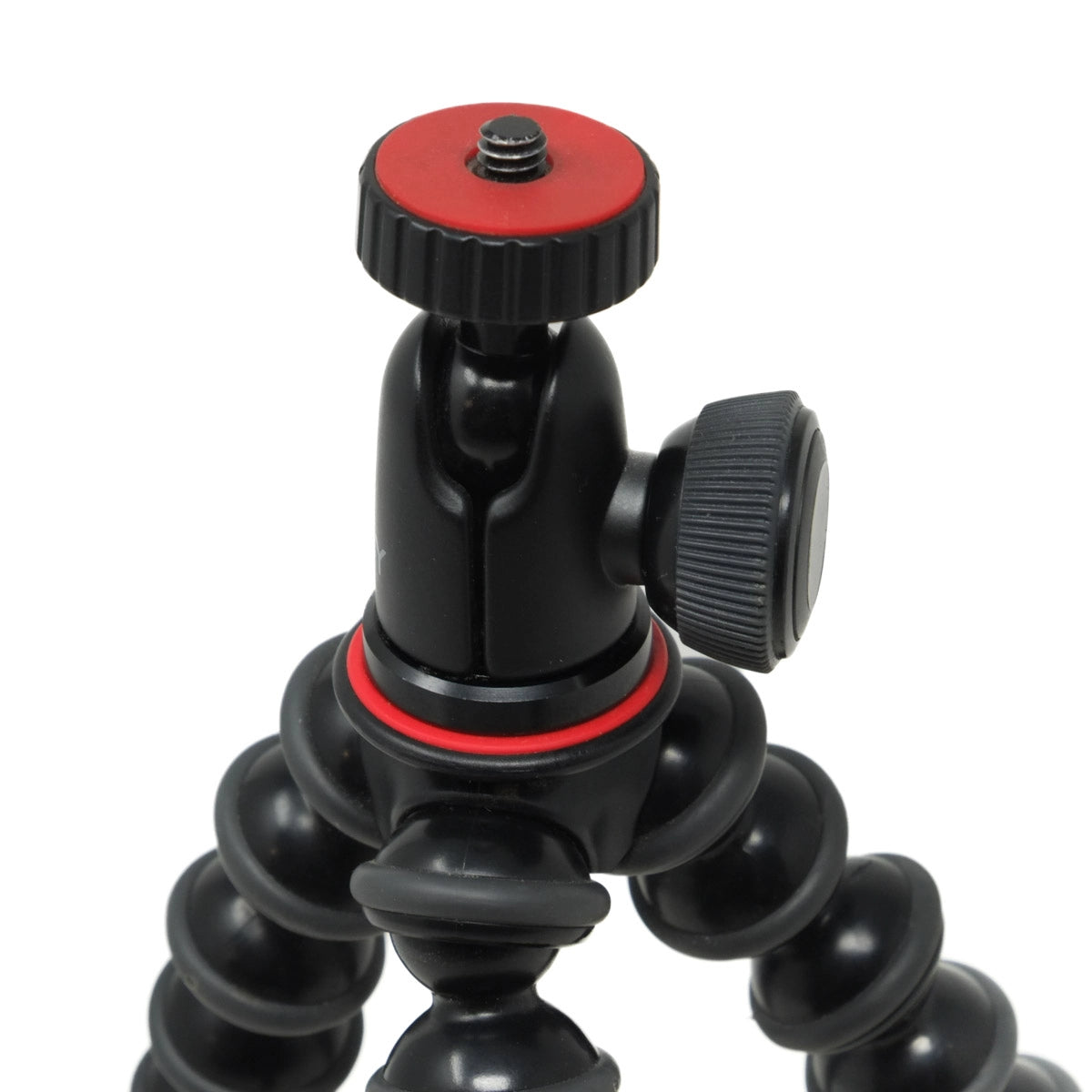 Black and red camera tripod on a white background