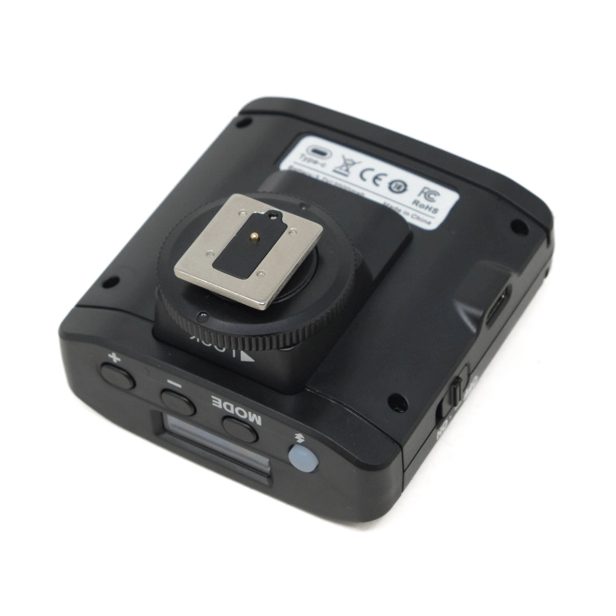 Black camera flash unit on a white background