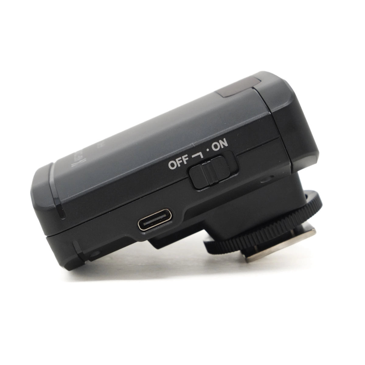 Black camera flash on a white background