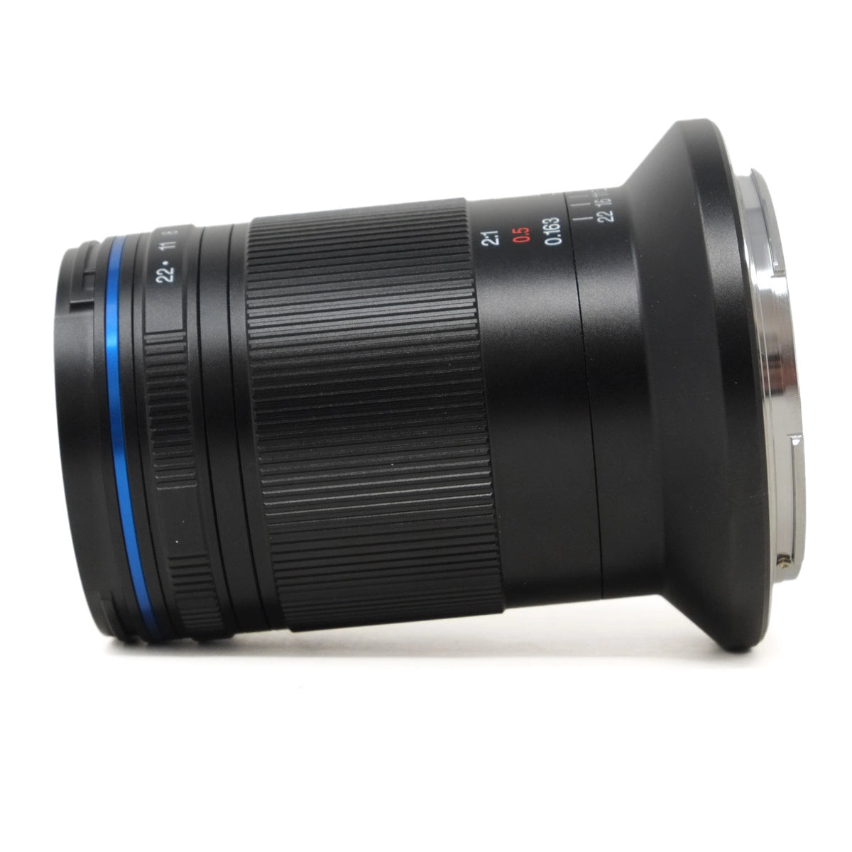 Camera lens with focus scale on a white background