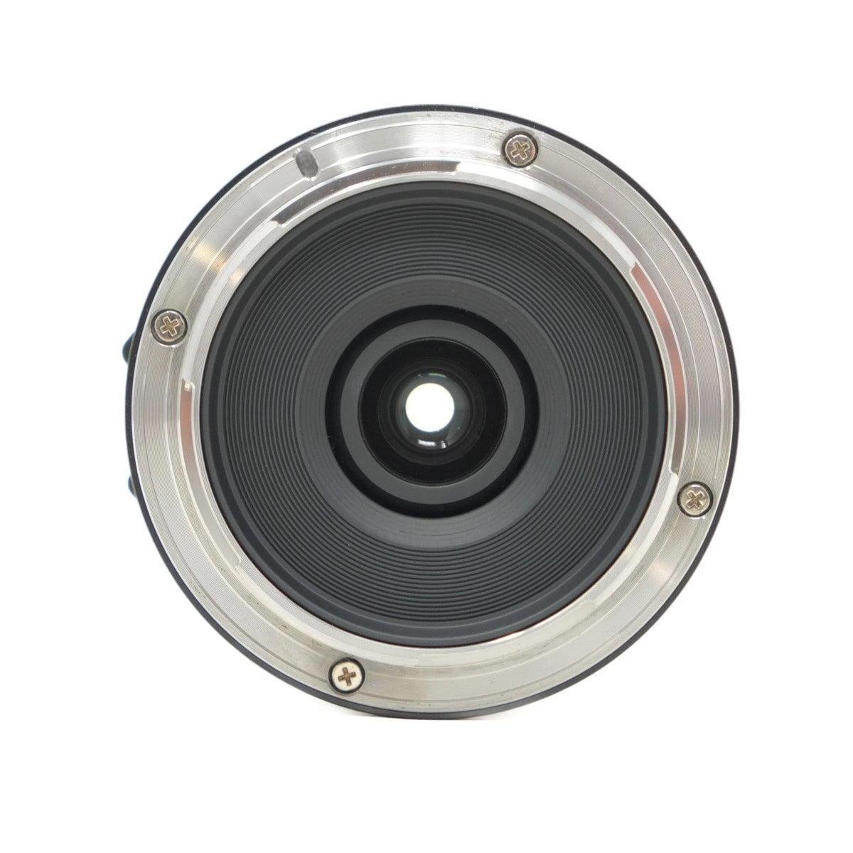 Camera lens with metallic rim on a white background