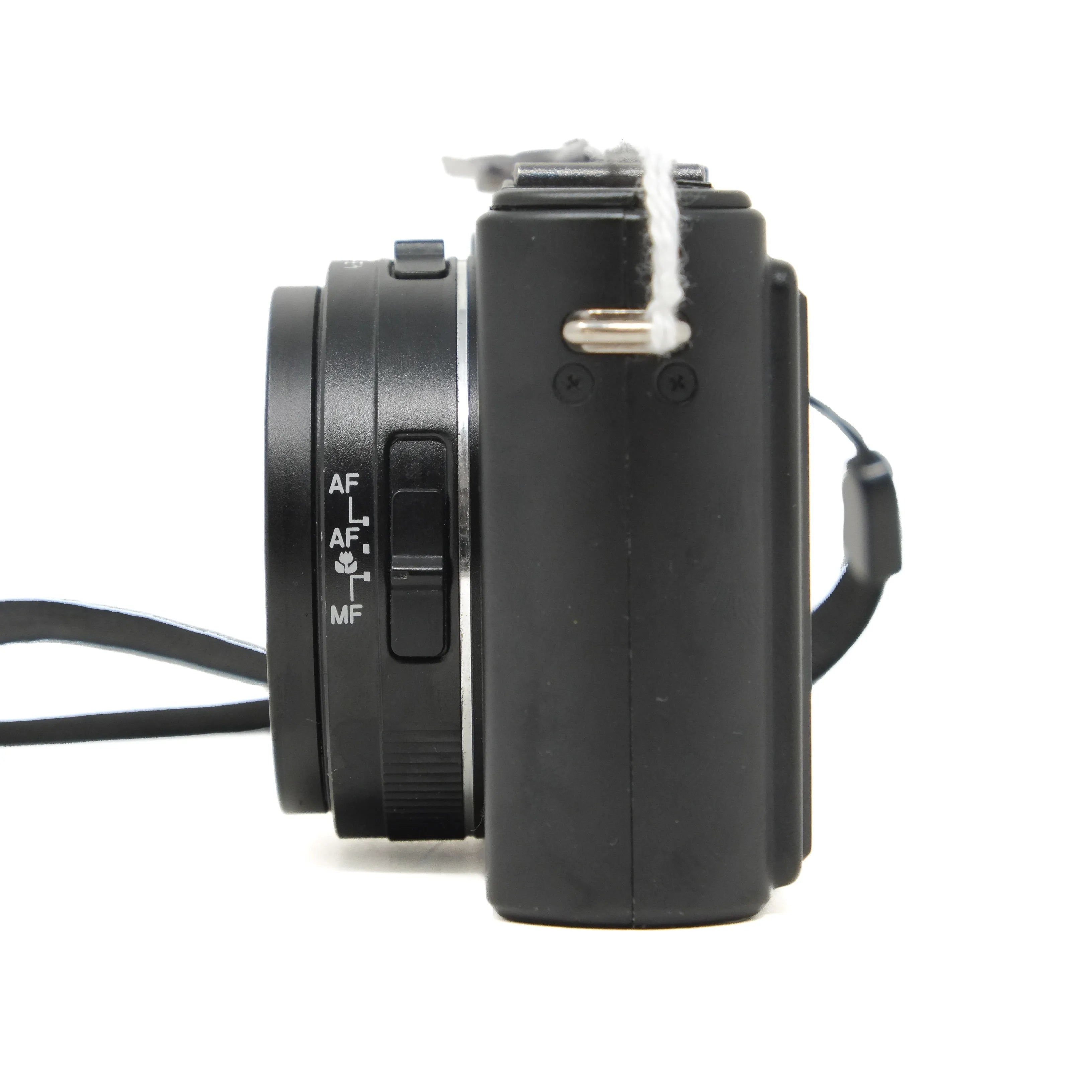 Black camera with lens and control buttons on a white background