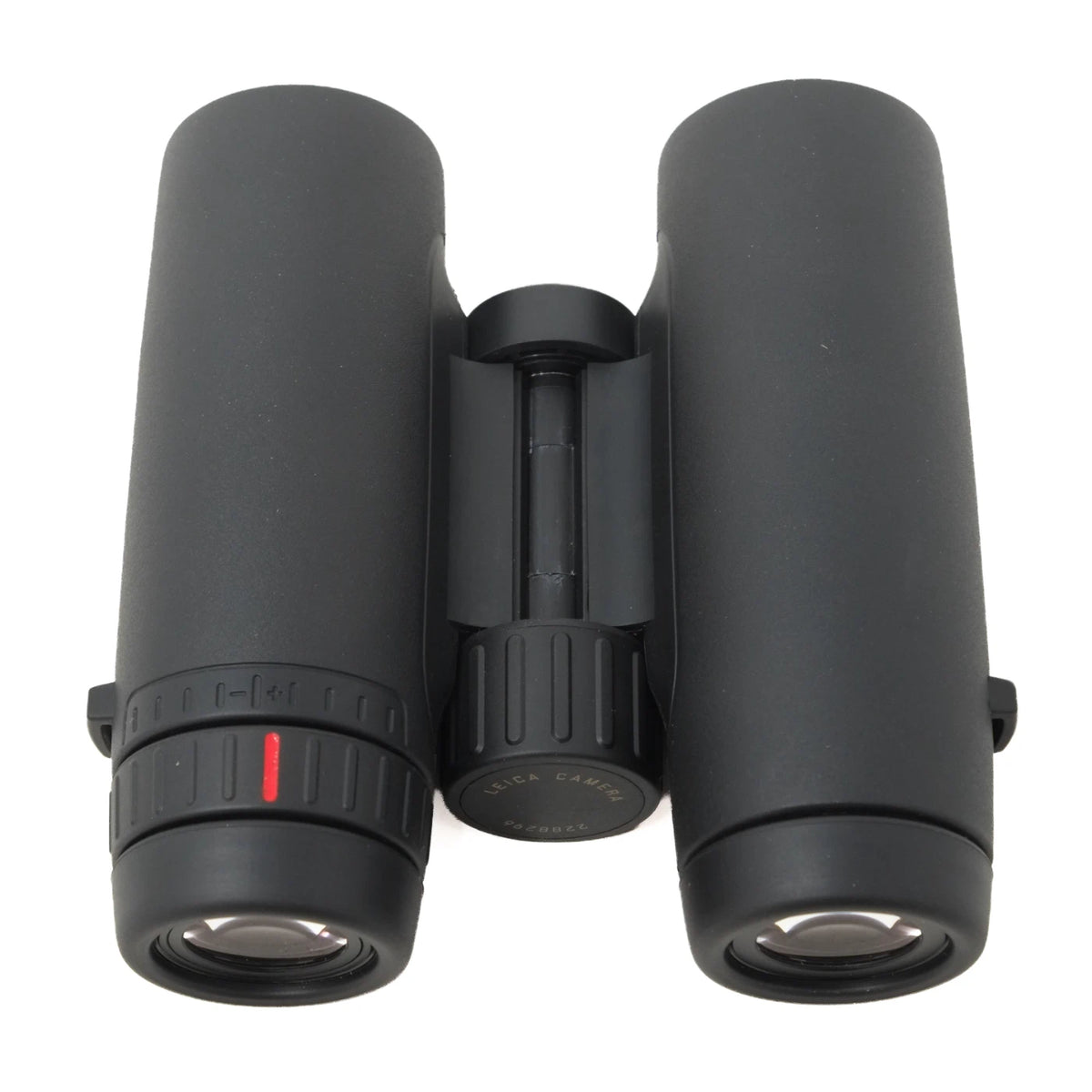 Black binoculars photographed on a clean white background, showing the front lenses, central hinge, and adjustment ring with a small red indicator mark.