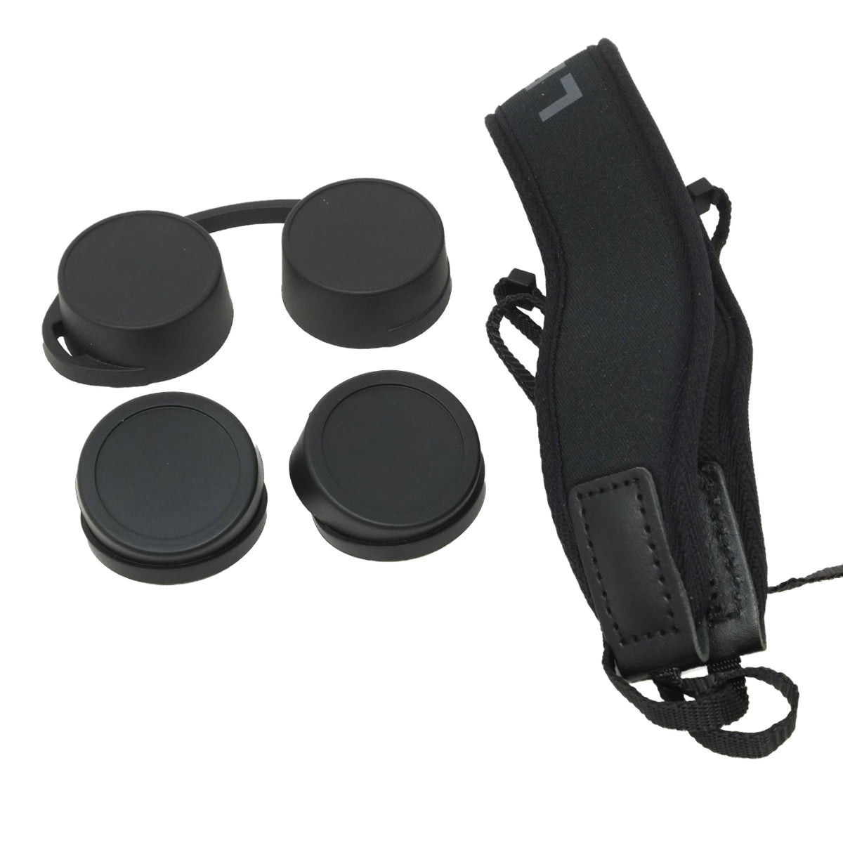 Four black lens caps with a connecting strap, shown next to a black nylon camera strap on a plain white background.