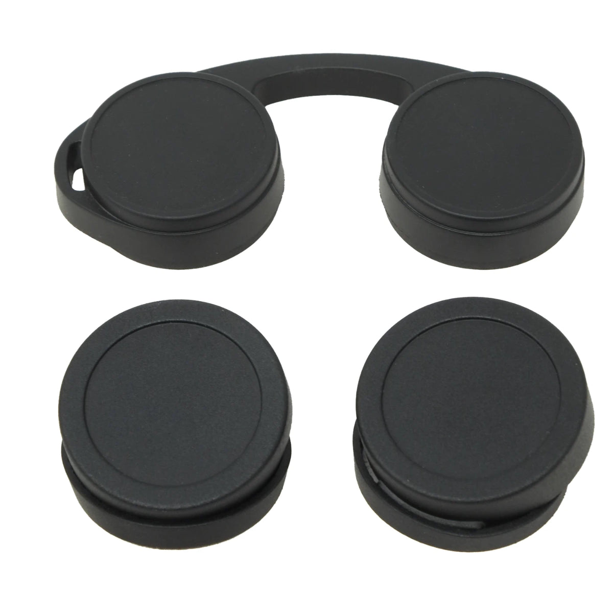 Four black circular camera lens caps arranged in a 2x2 grid on a plain white background.