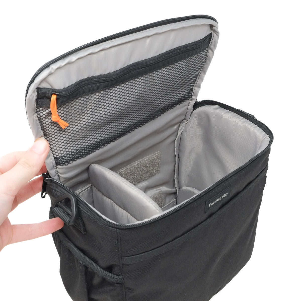 Black bag with open compartment showing interior details on a white background