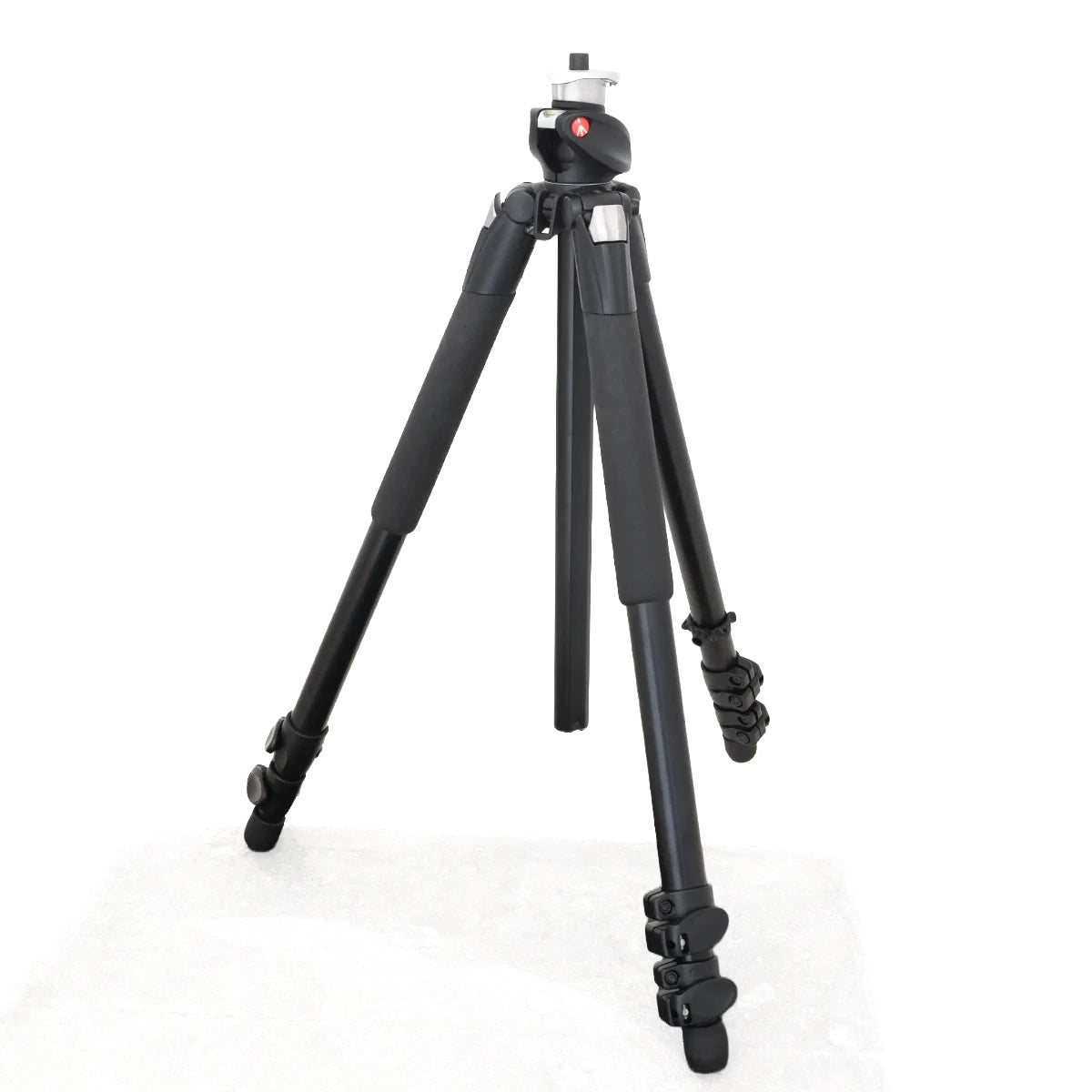 A black tripod with a ball head and leg locks, photographed on a white background.