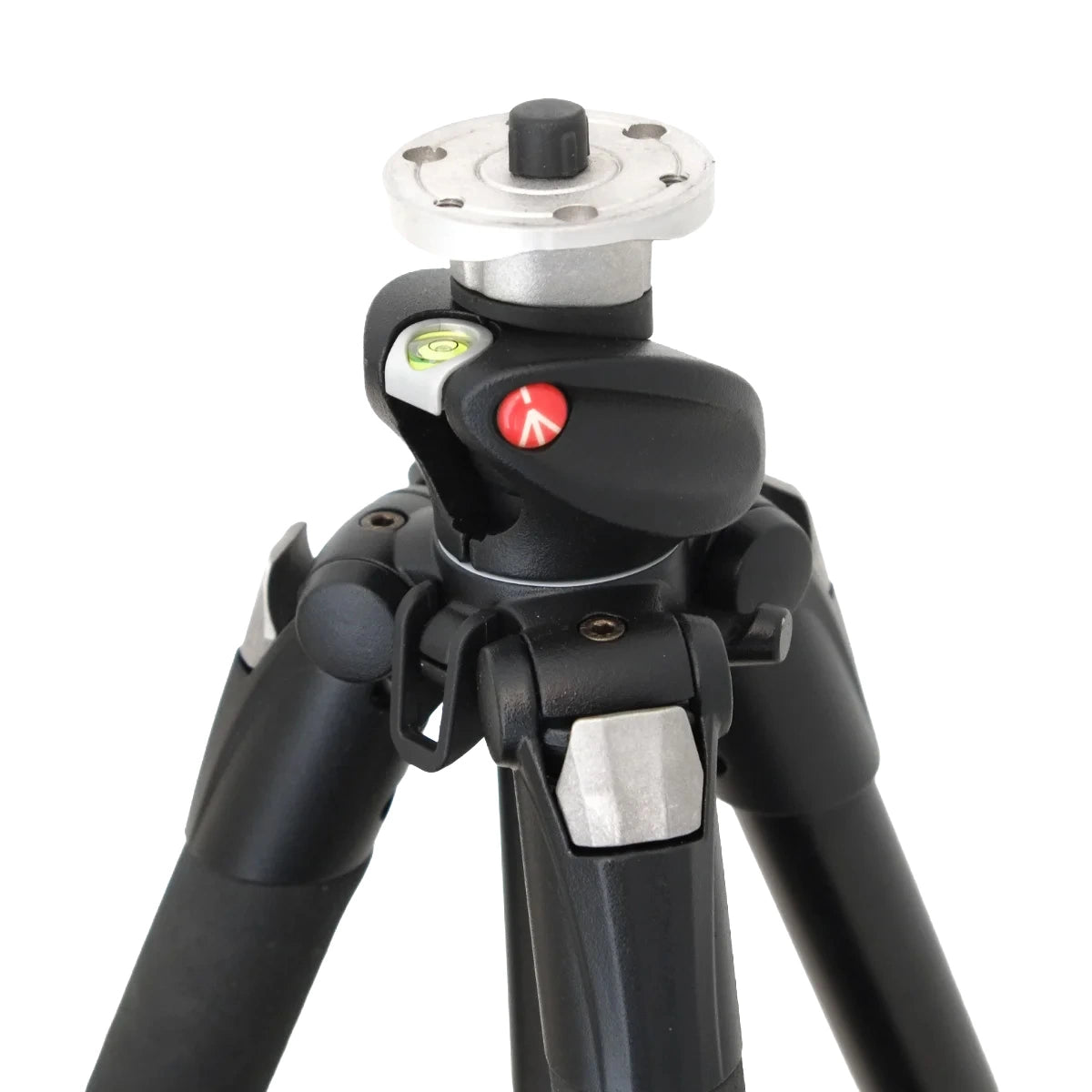 Close-up of a tripod head and lower legs, showing a black quick-release head with silver metal components, a red release button, and a level bubble, on a white background.