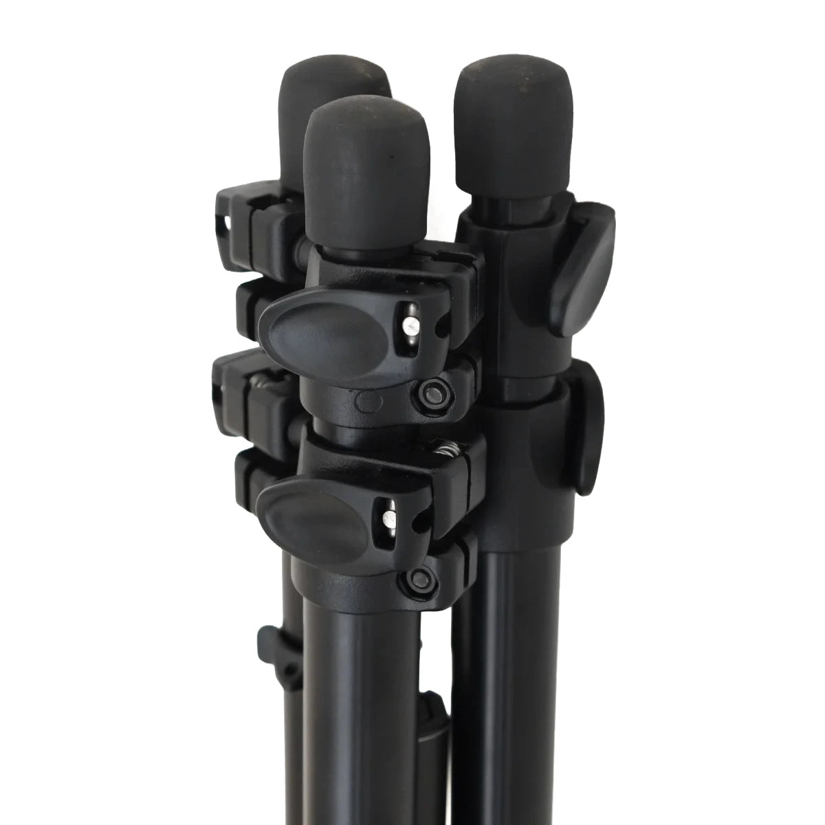 Close-up of the tripod head and lower legs of a black camera tripod against a plain white background.