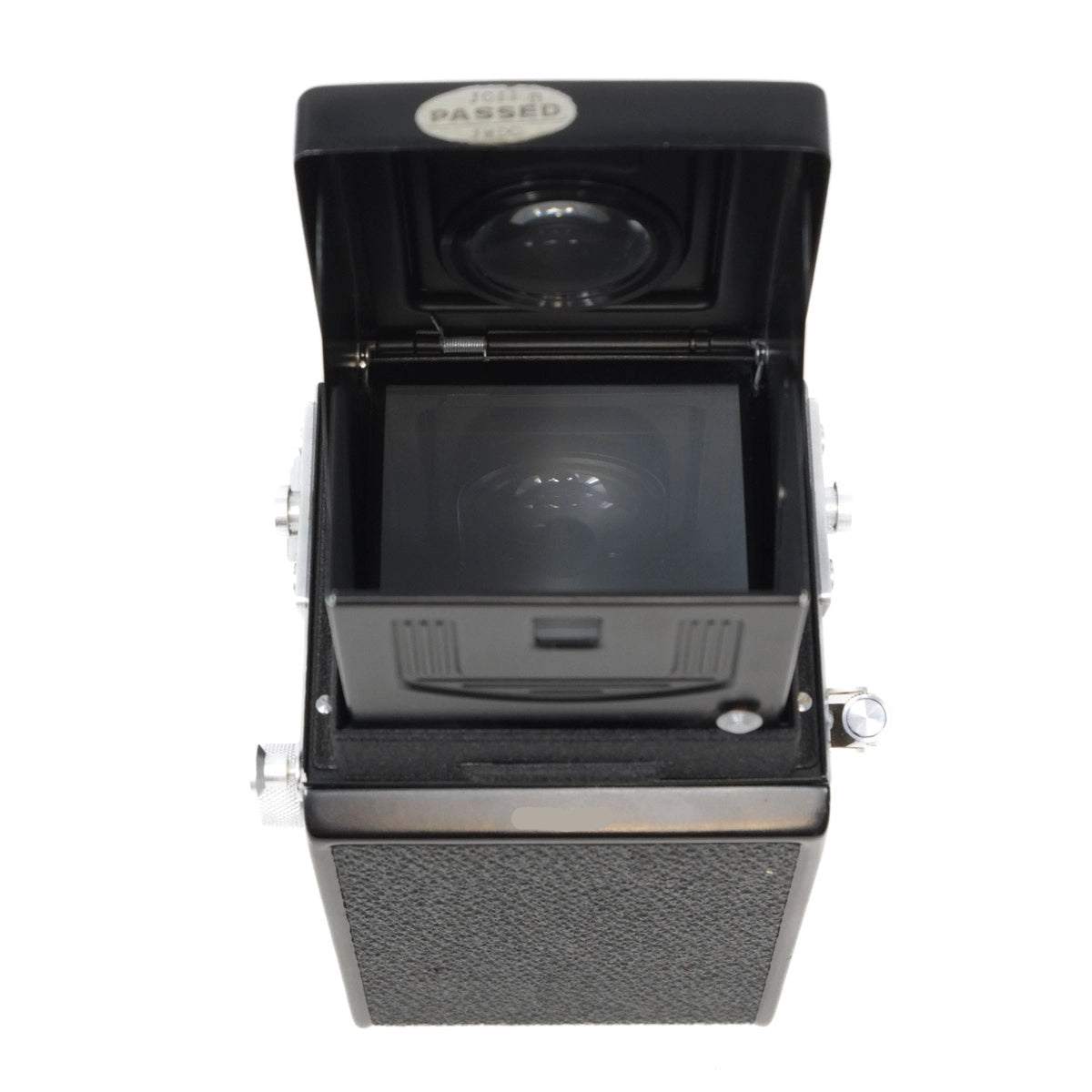 Vintage camera with open lid on a white background