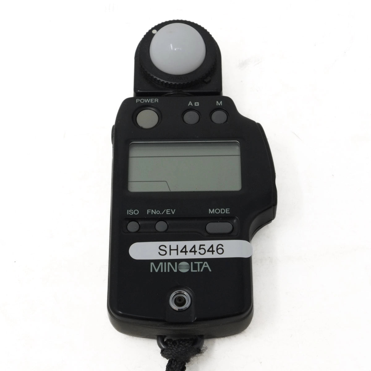 Minolta light meter with digital display on a white background