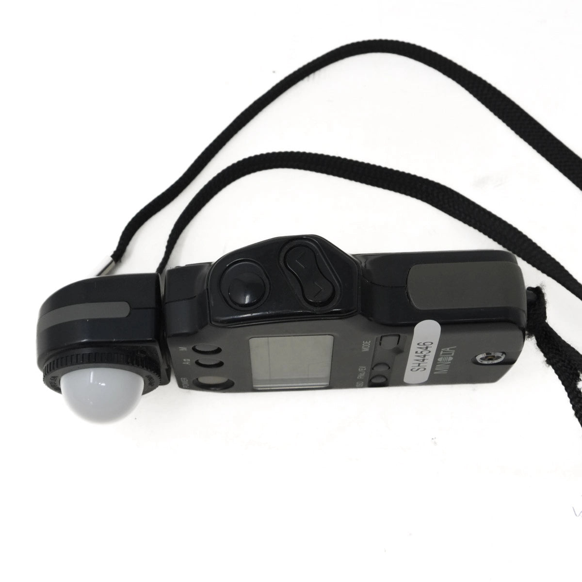 Black light meter with digital display on a white background