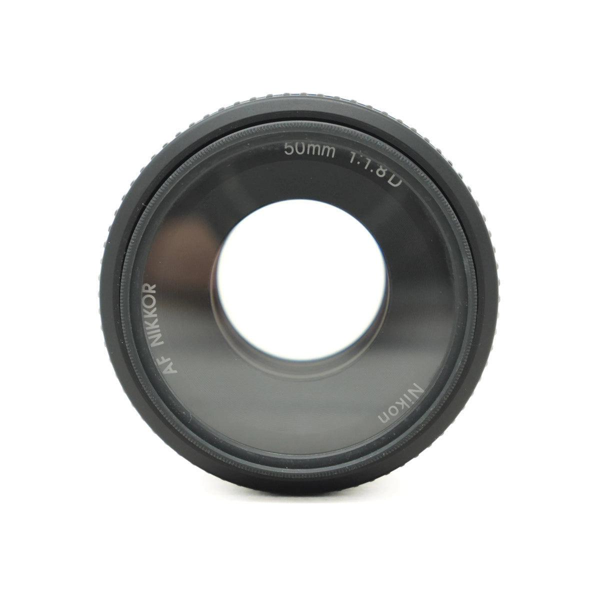 Camera lens with 'Nikon' branding on a white background