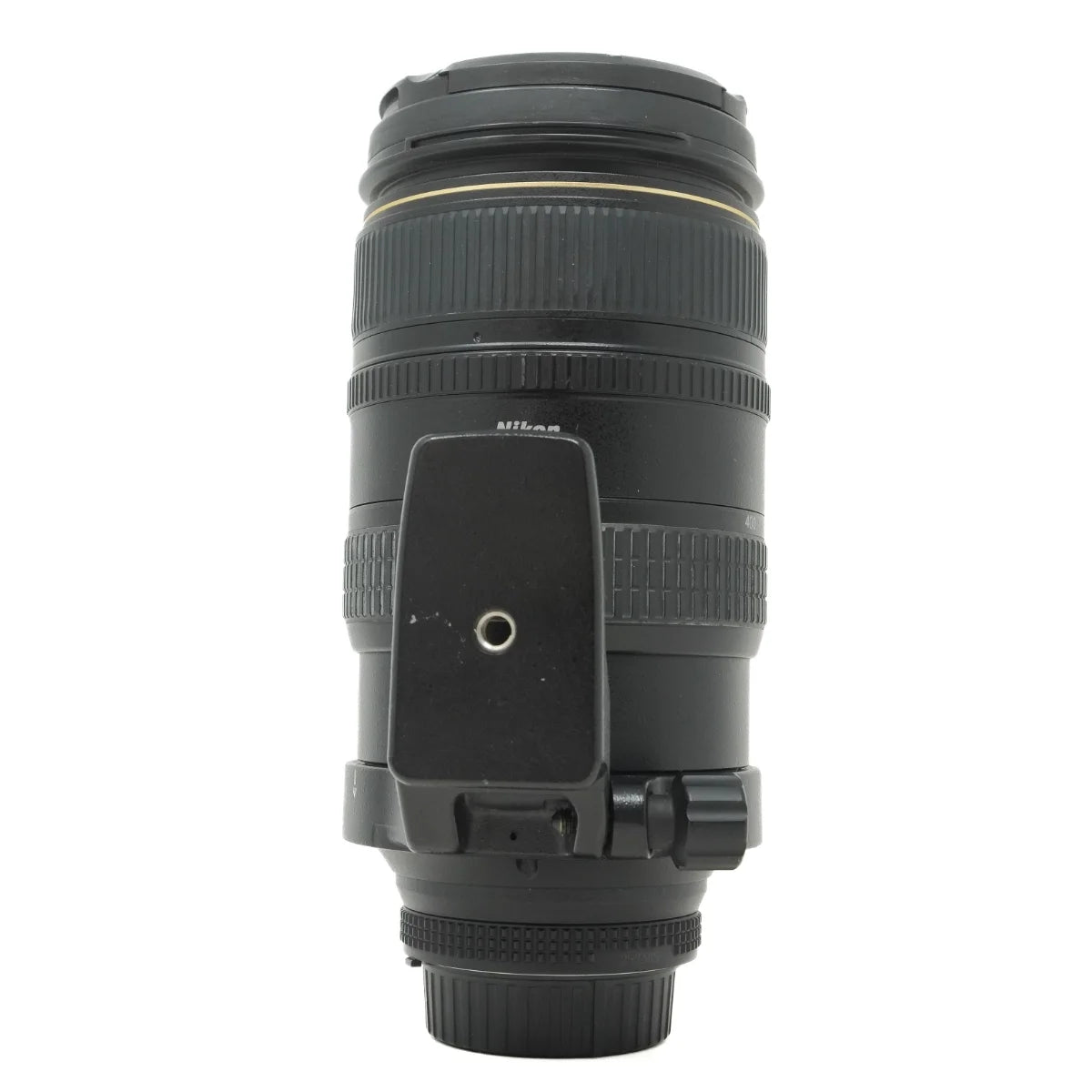 A Nikon telephoto lens in black with a gold ring accent, shown against a plain white background.