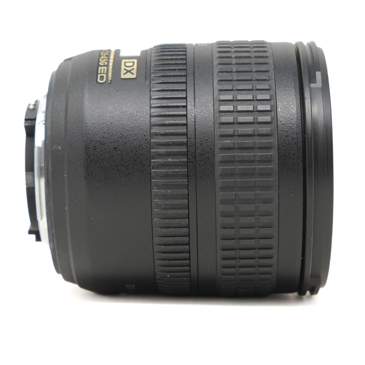 Camera lens with 'DX' and 'G' branding on a white background