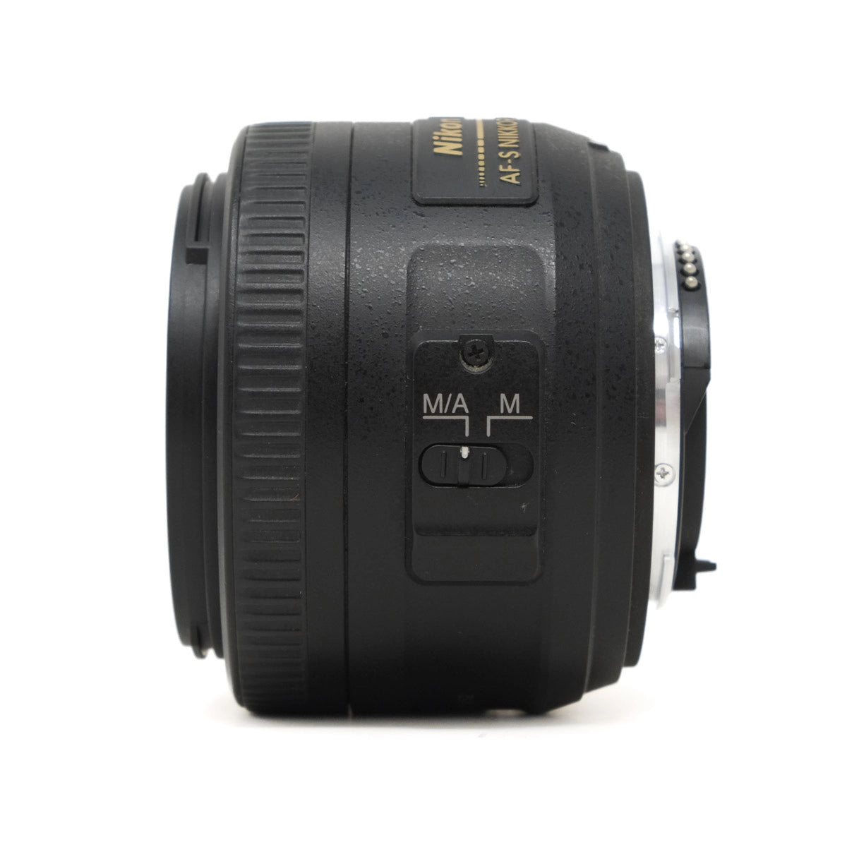 Camera lens with control dials on a white background
