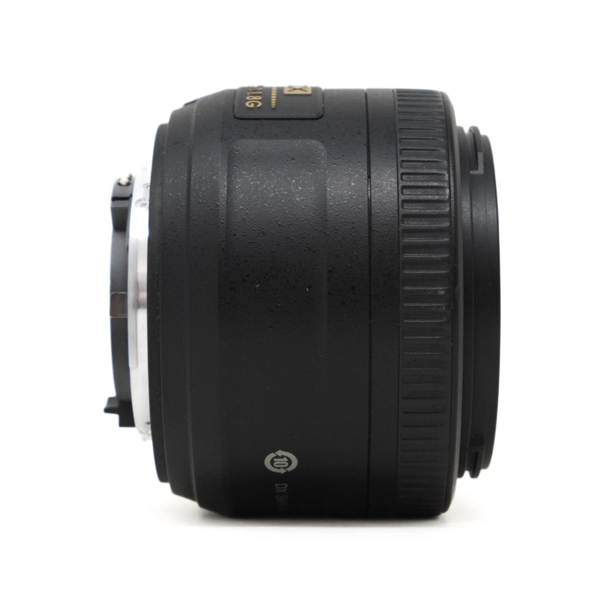 Black camera lens on a white background