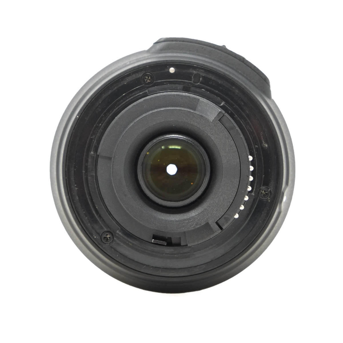 A close-up, top-down view of a camera lens focusing assembly, showing the internal rings and glass element on a solid white background.