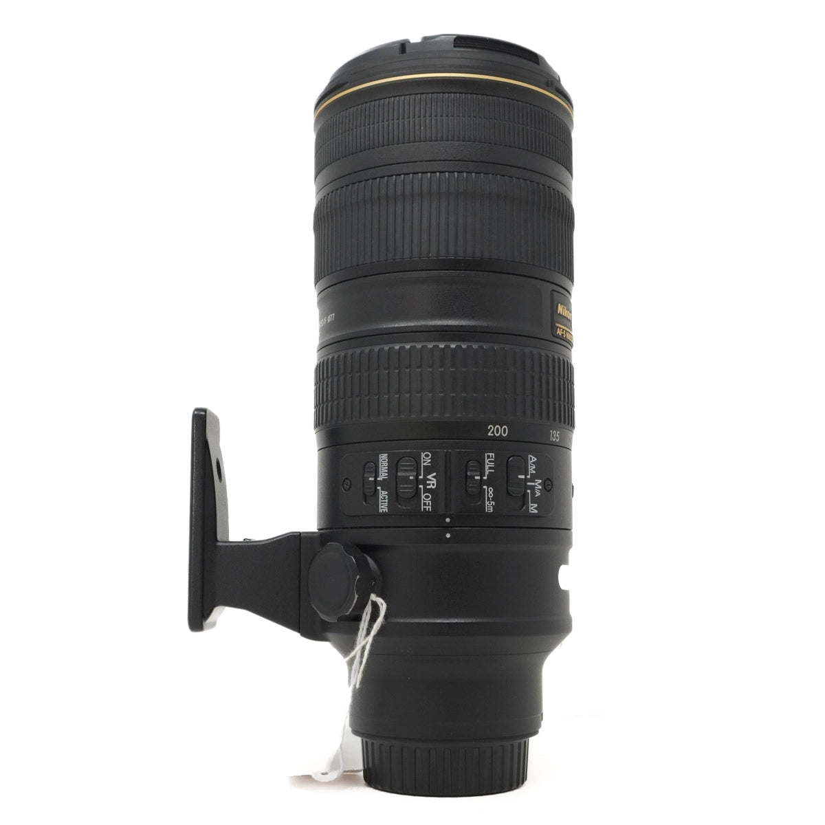 Camera lens with focus ring and control buttons on a white background