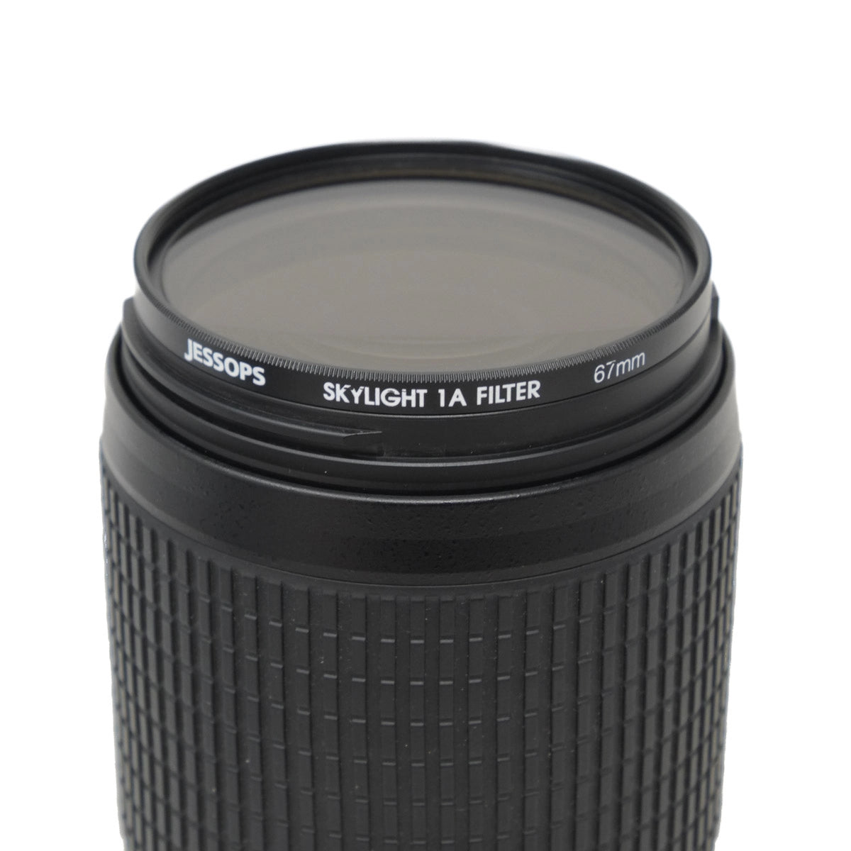 Camera lens with Jessops Skylight 1A filter on a white background
