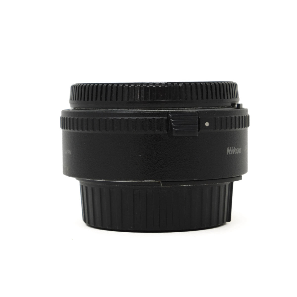 Black Nikon camera lens teleconverter on a white background
