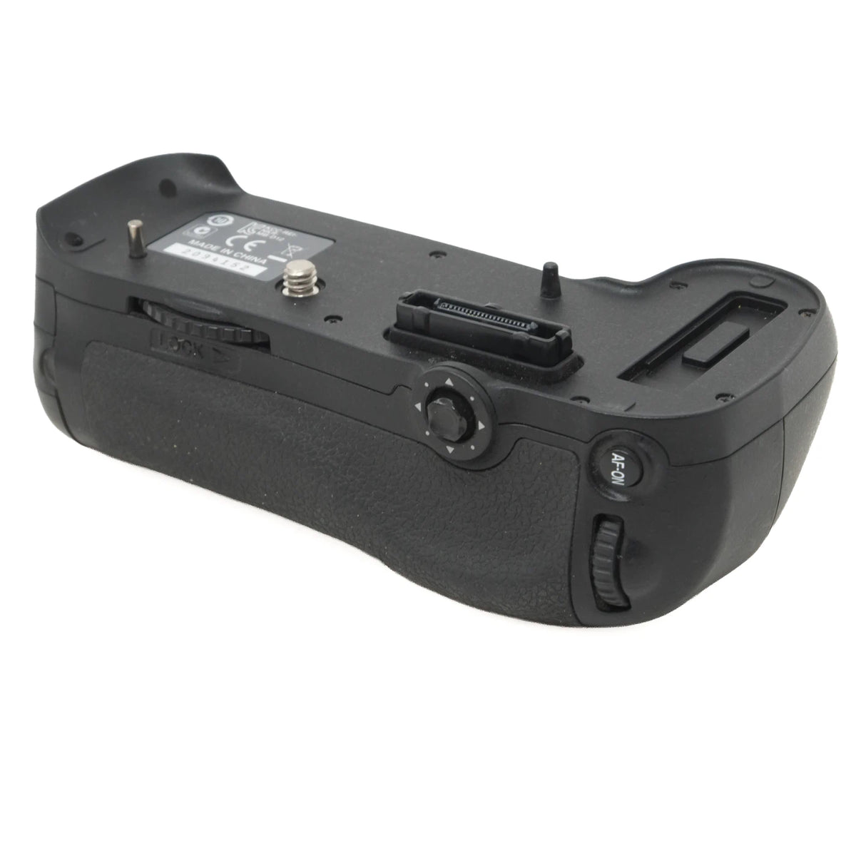 Black camera battery grip with a textured grip, dial, and adjustment knobs, shown from the underside against a white background.
