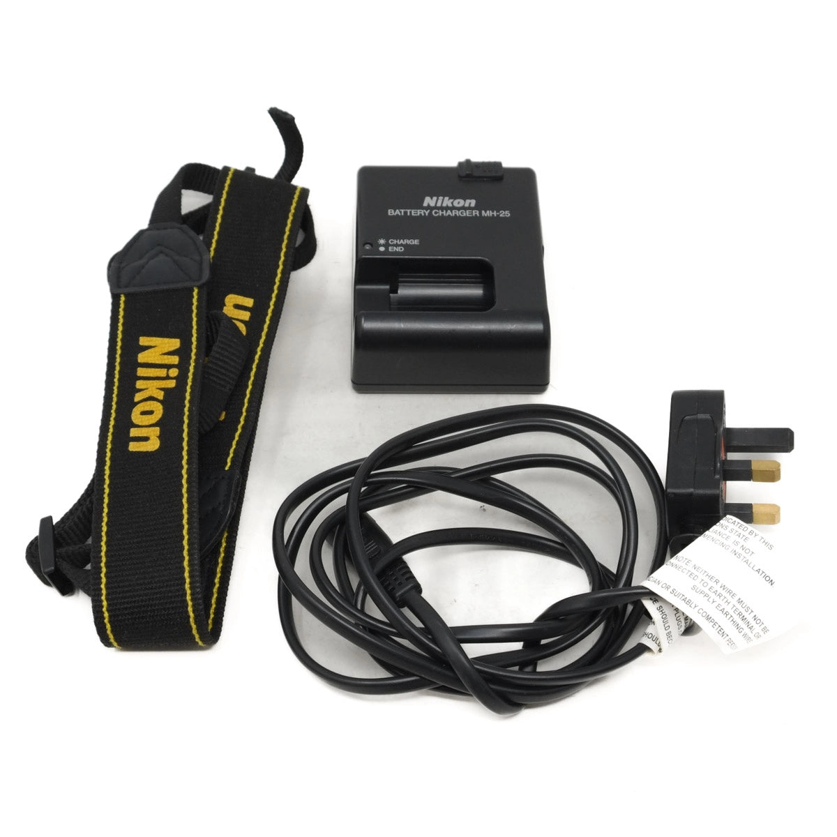 Nikon camera strap, battery charger, and cables on a white background