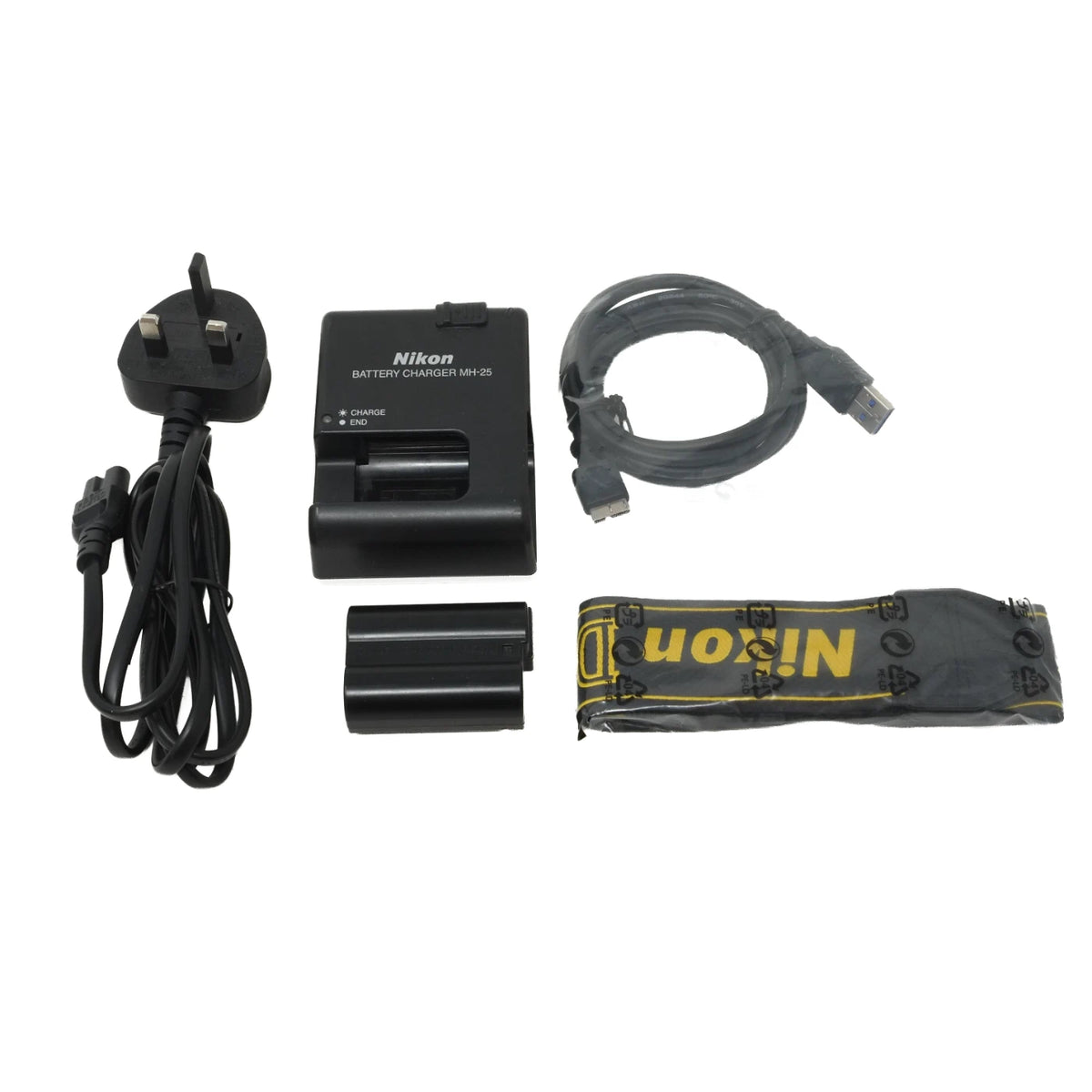 Nikon DLR battery charger kit including a UK three-pin power adapter, dual battery charger, battery, USB cable, and carrying pouch on a white background.