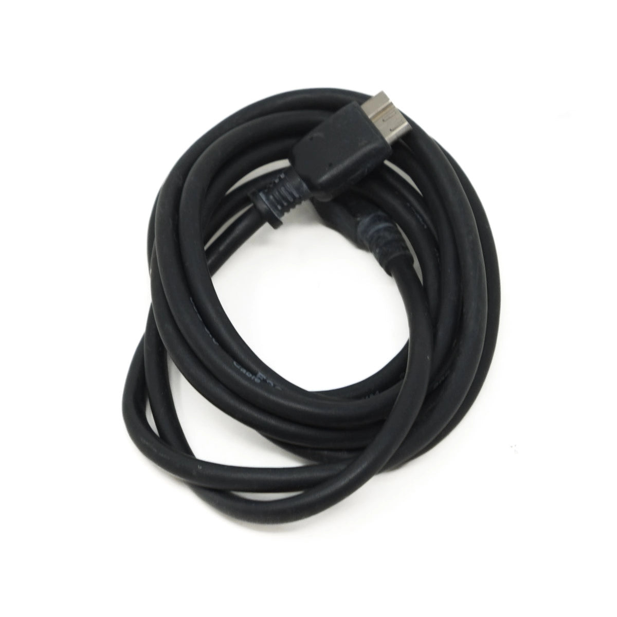 Coiled black cable on a white background