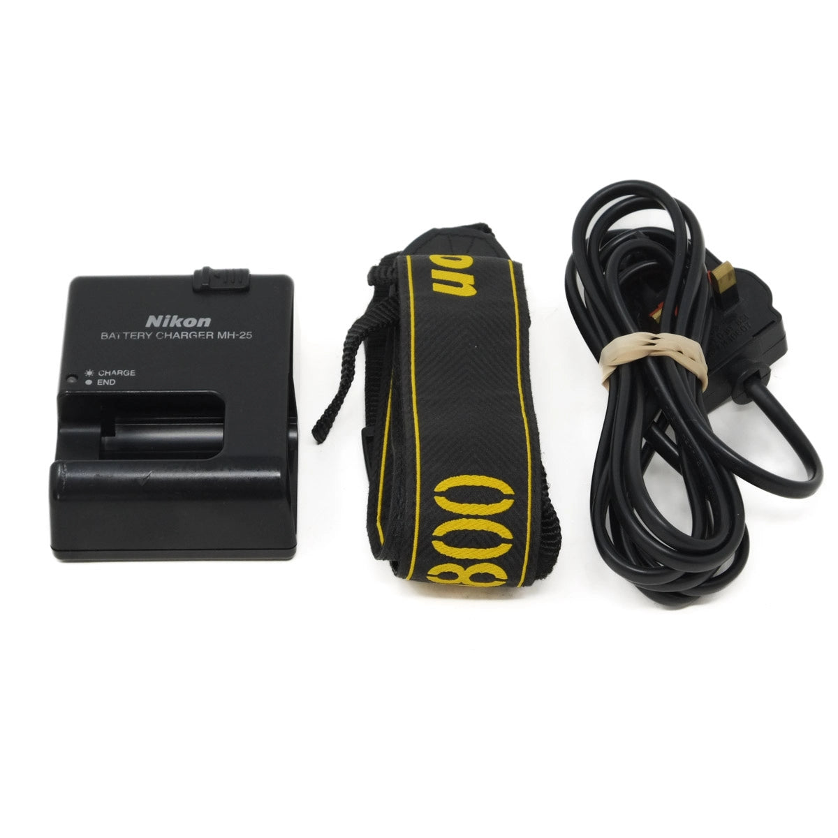Nikon battery charger, strap, and cable on a white background