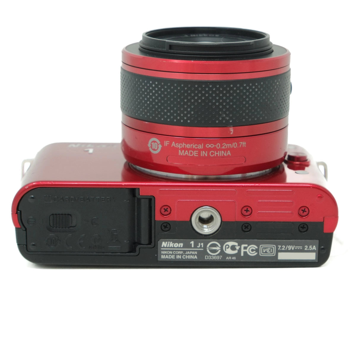 Red and black camera lens on a white background