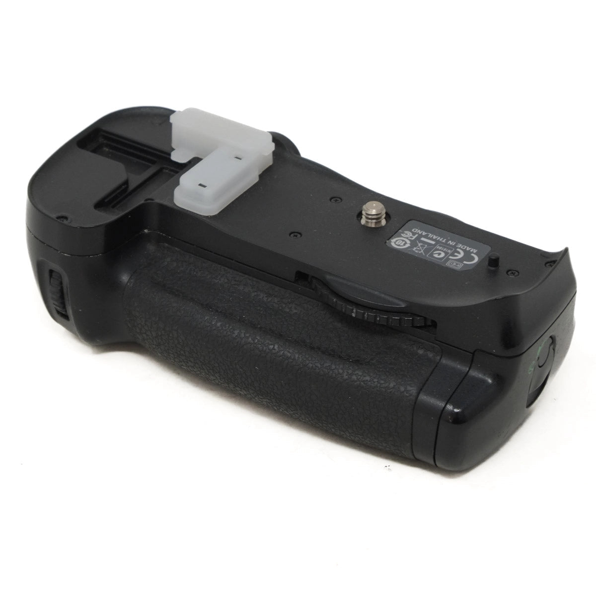 Black camera battery grip on a white background