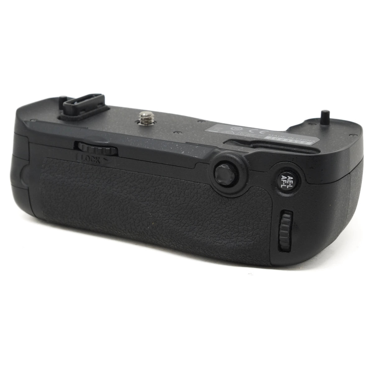 Black camera battery grip on a white background