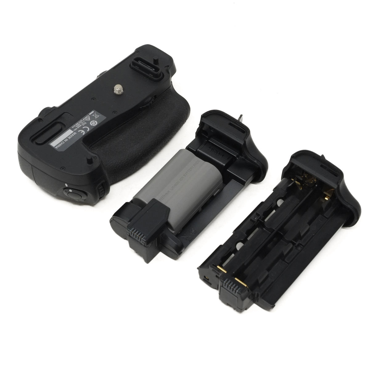 Camera battery grip, battery and battery trays on a white background