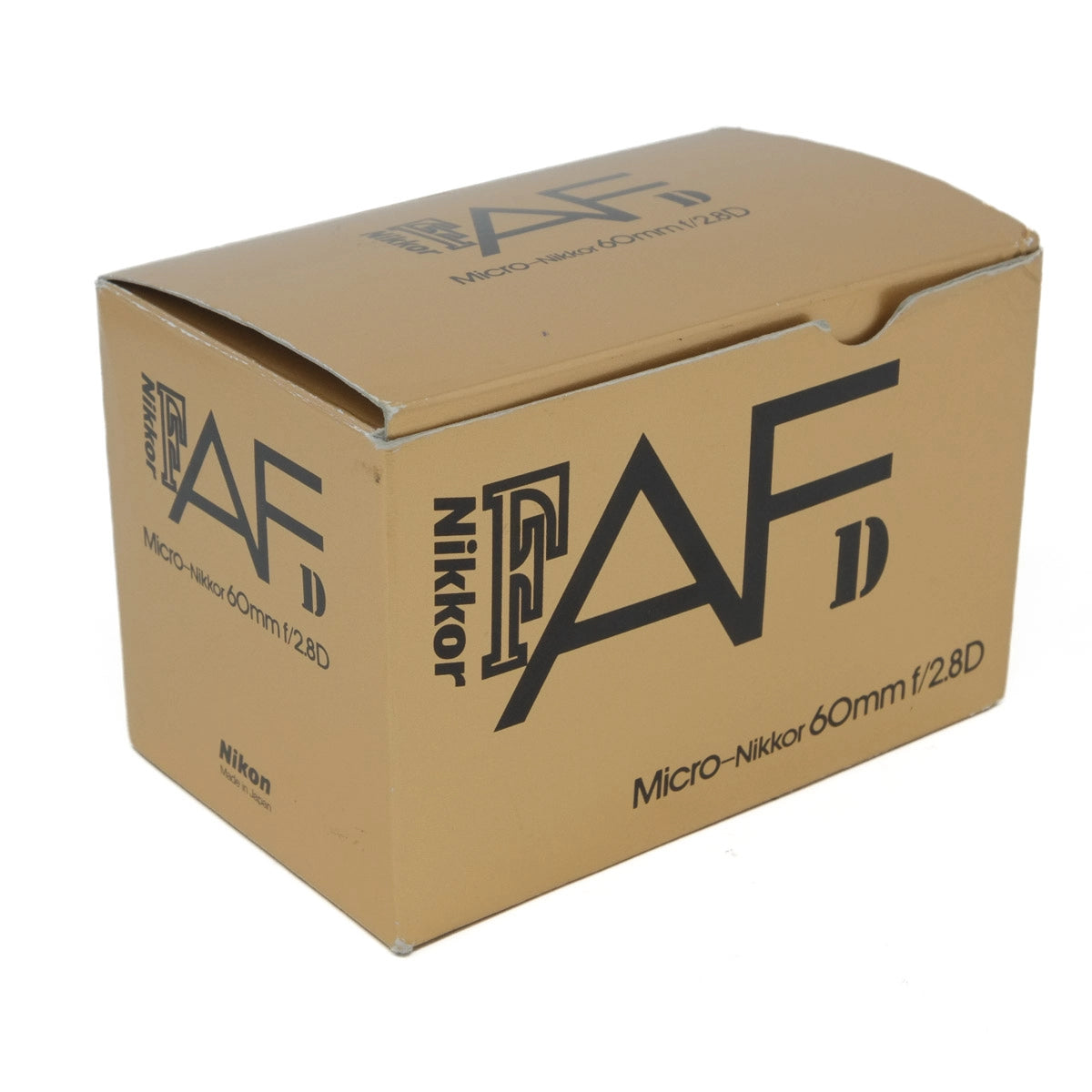 Cardboard box with Nikon AF Nikkor lens branding on a white background