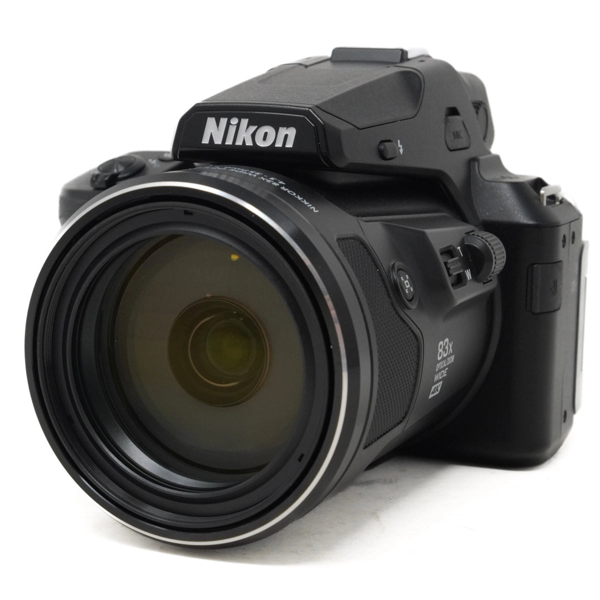 Nikon camera with large lens on a white background