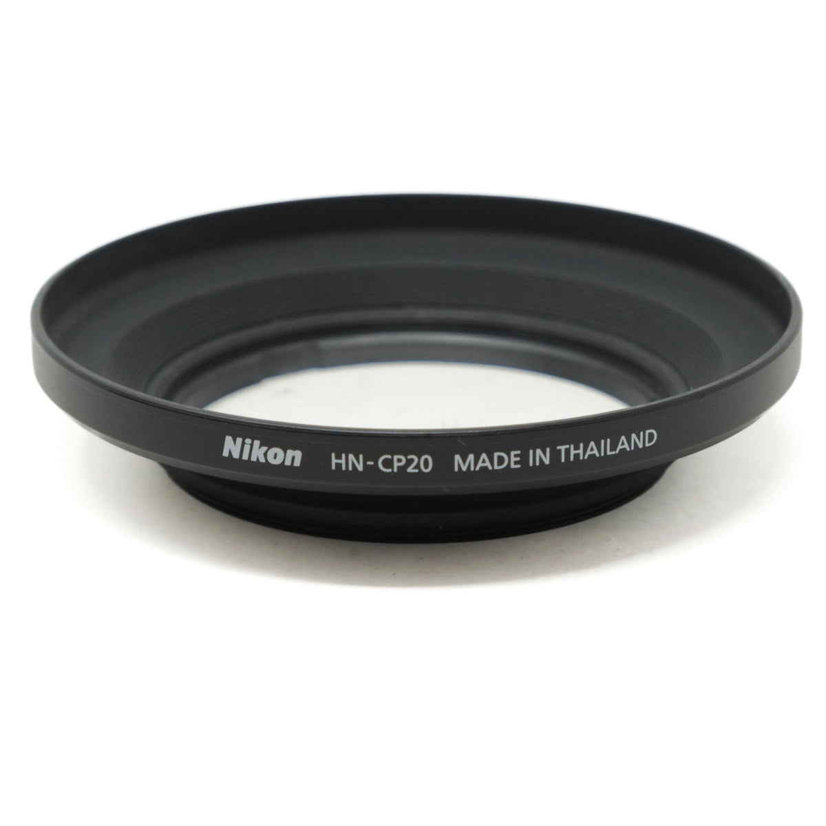 Nikon lens hood with 'Made in Thailand' text on a white background