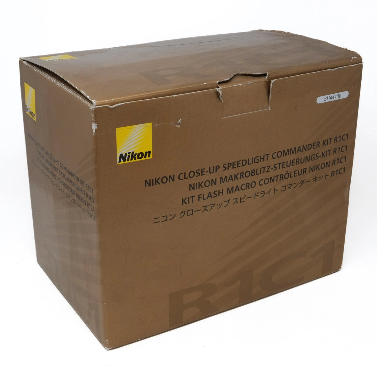 Brown cardboard box with Nikon branding on a white background