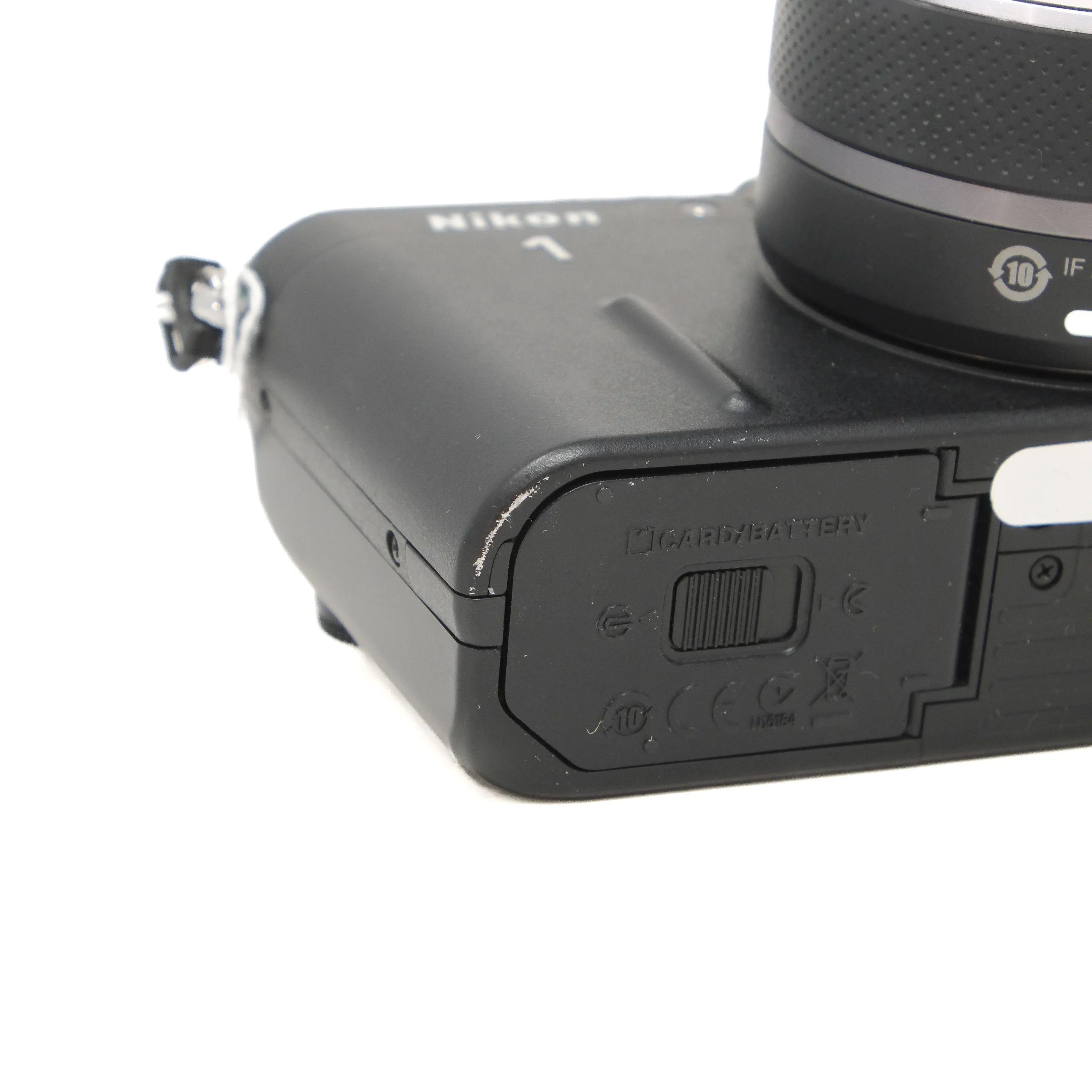Nikon camera body with lens on a white background