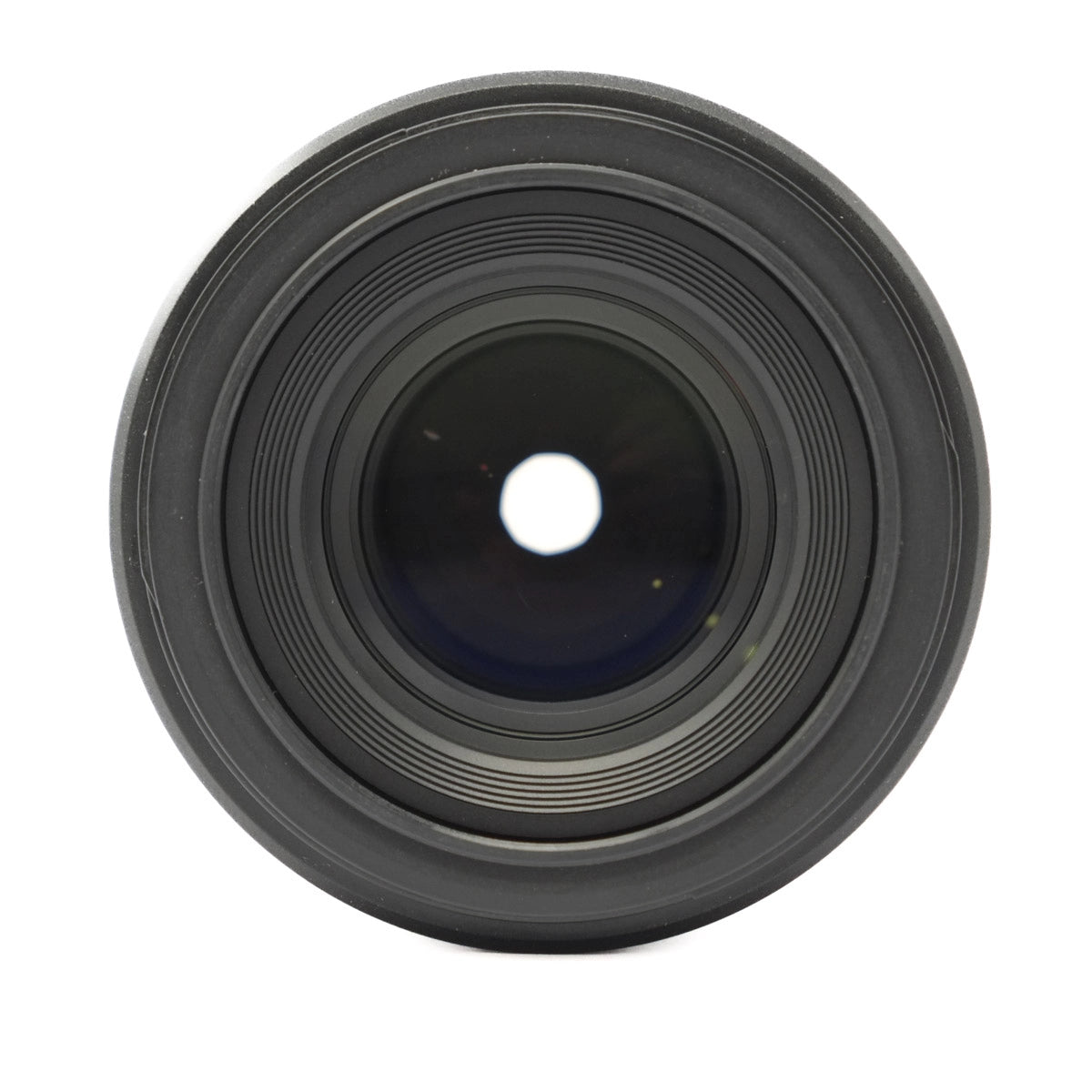 Black camera lens on a white background
