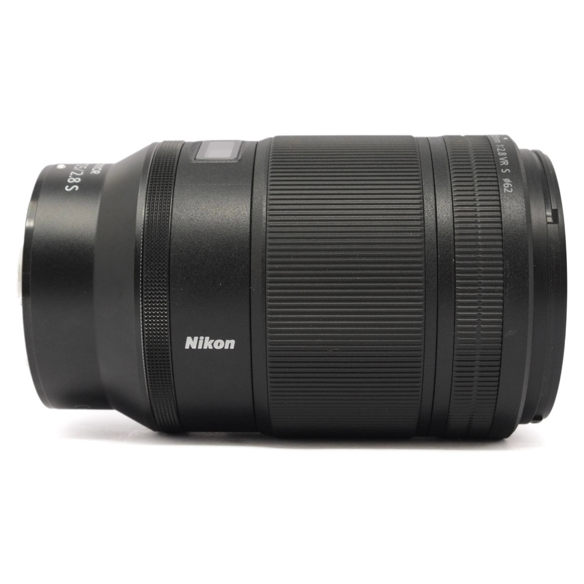 Black Nikon camera lens on a white background