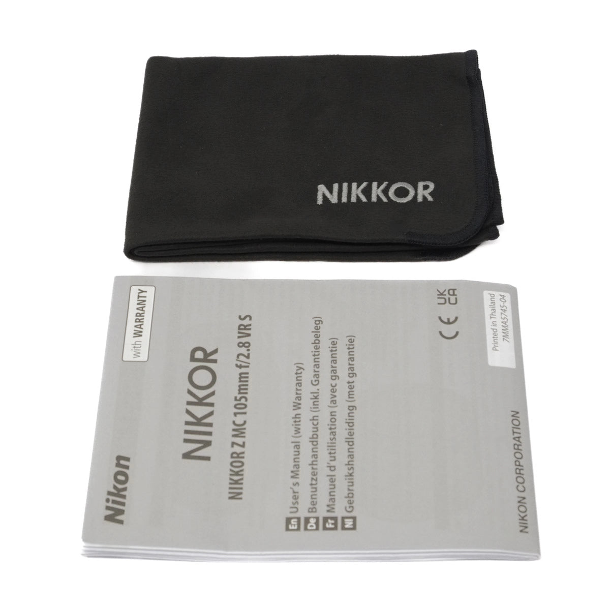 Nikon lens instructions with black cloth on a white background