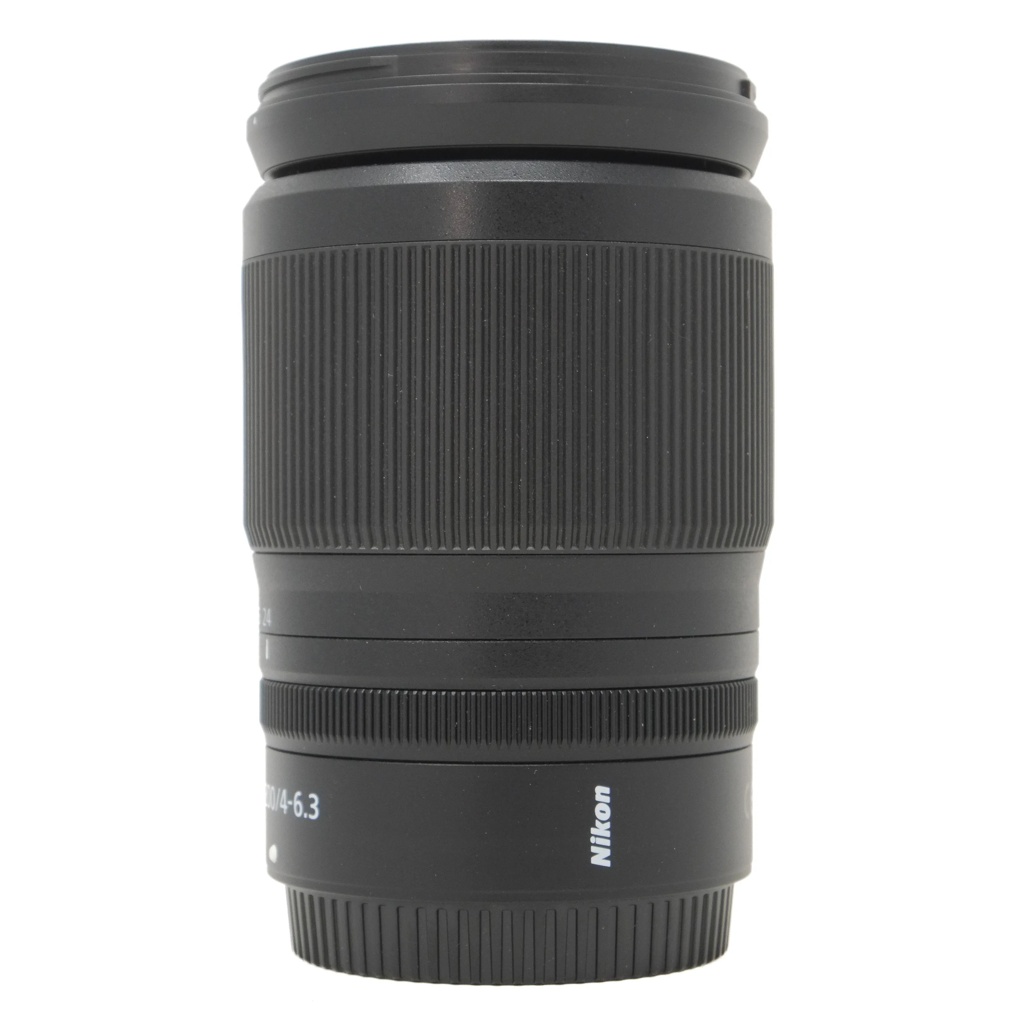 Black Nikon camera lens on a white background