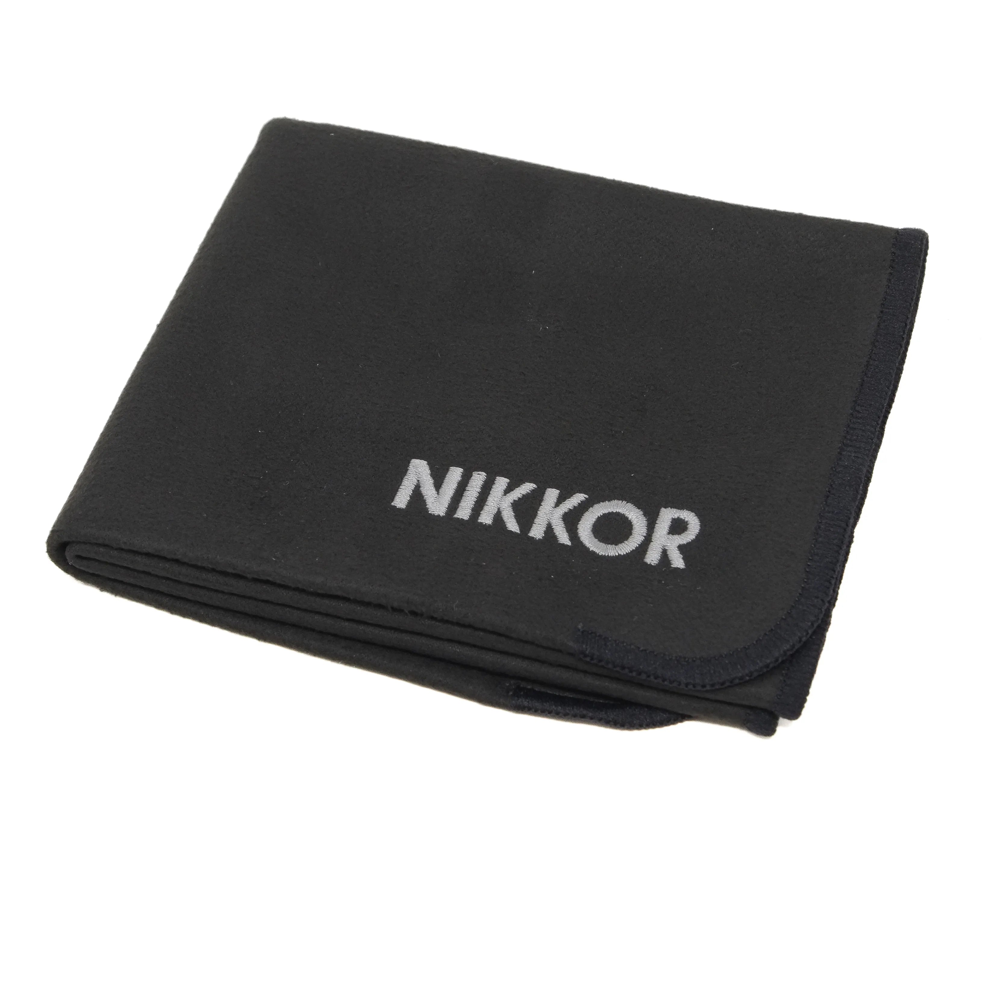 Black cloth with 'Nikkor' branding on a white background