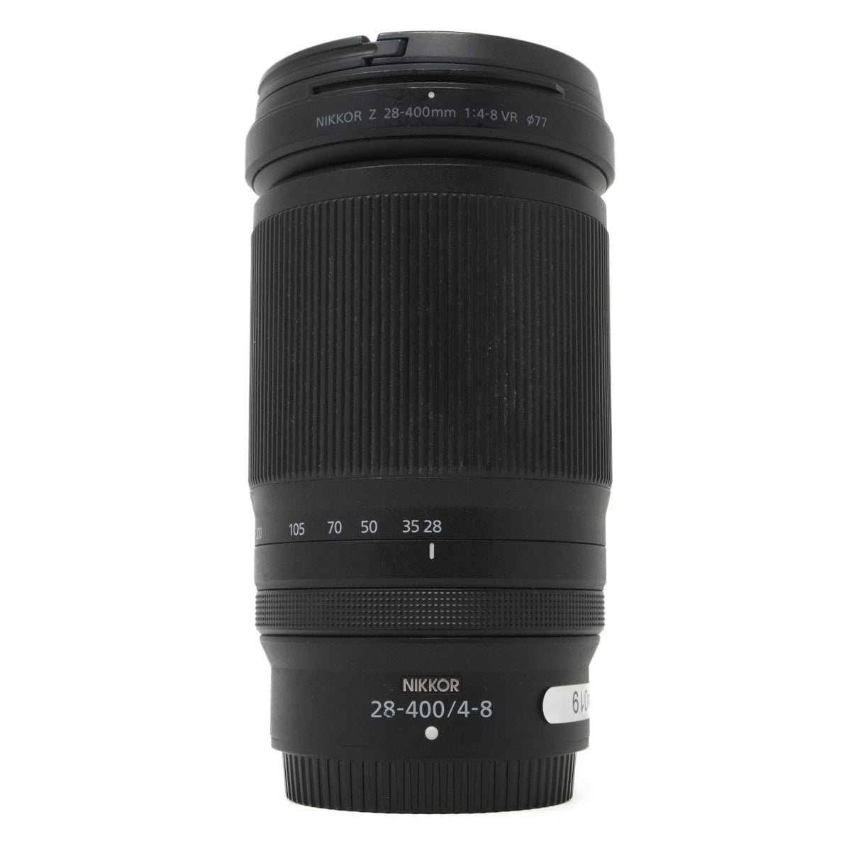 Black camera lens with 'Nikkor' branding on a white background