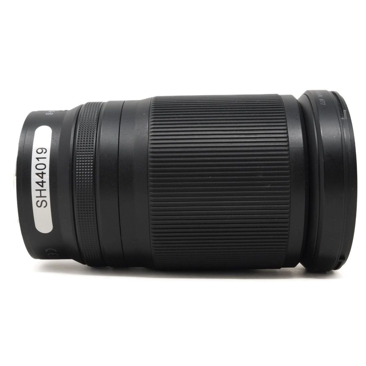 Black camera lens on a white background