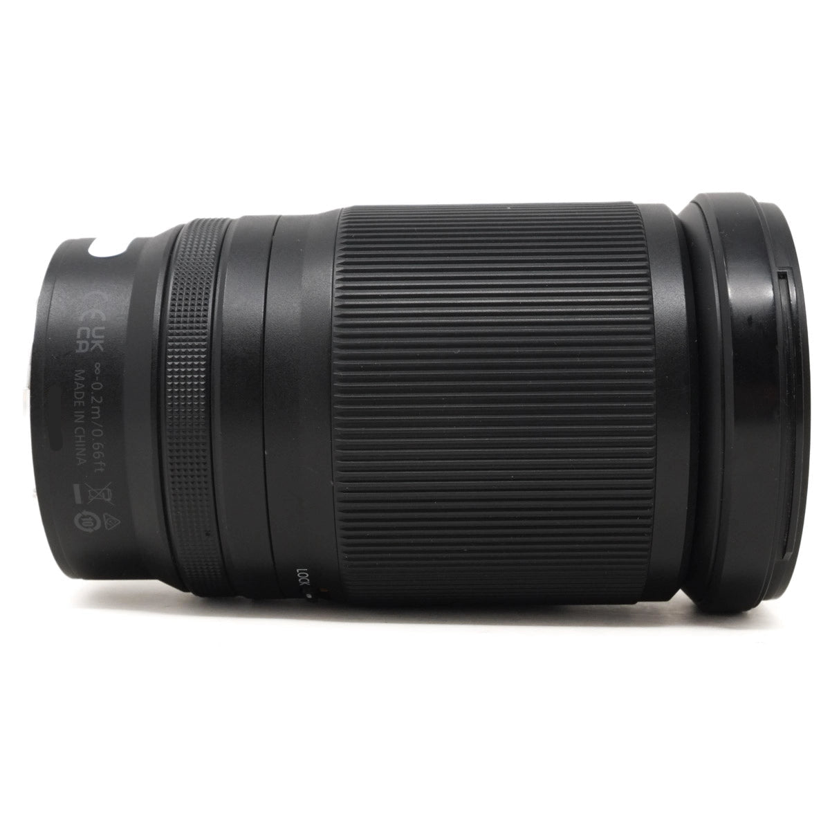 Black camera lens on a white background